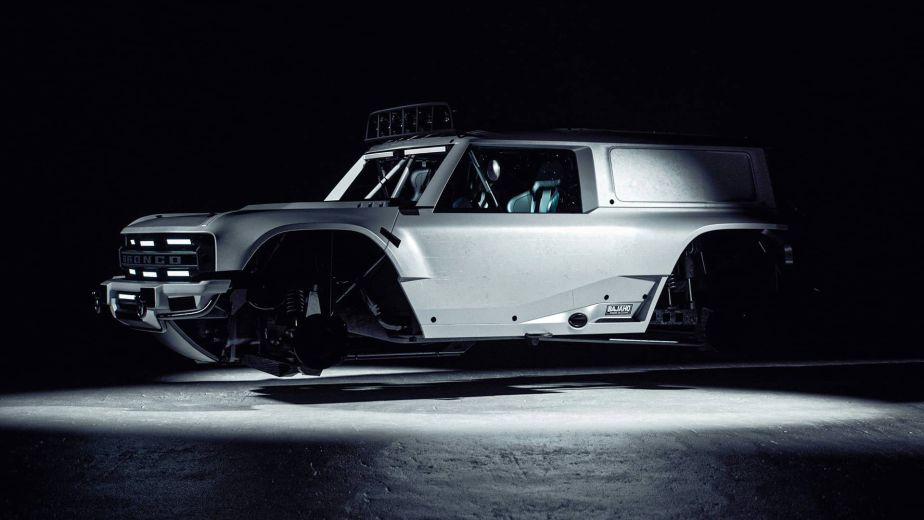 Custom Ford Bronco race build on display against a dark background