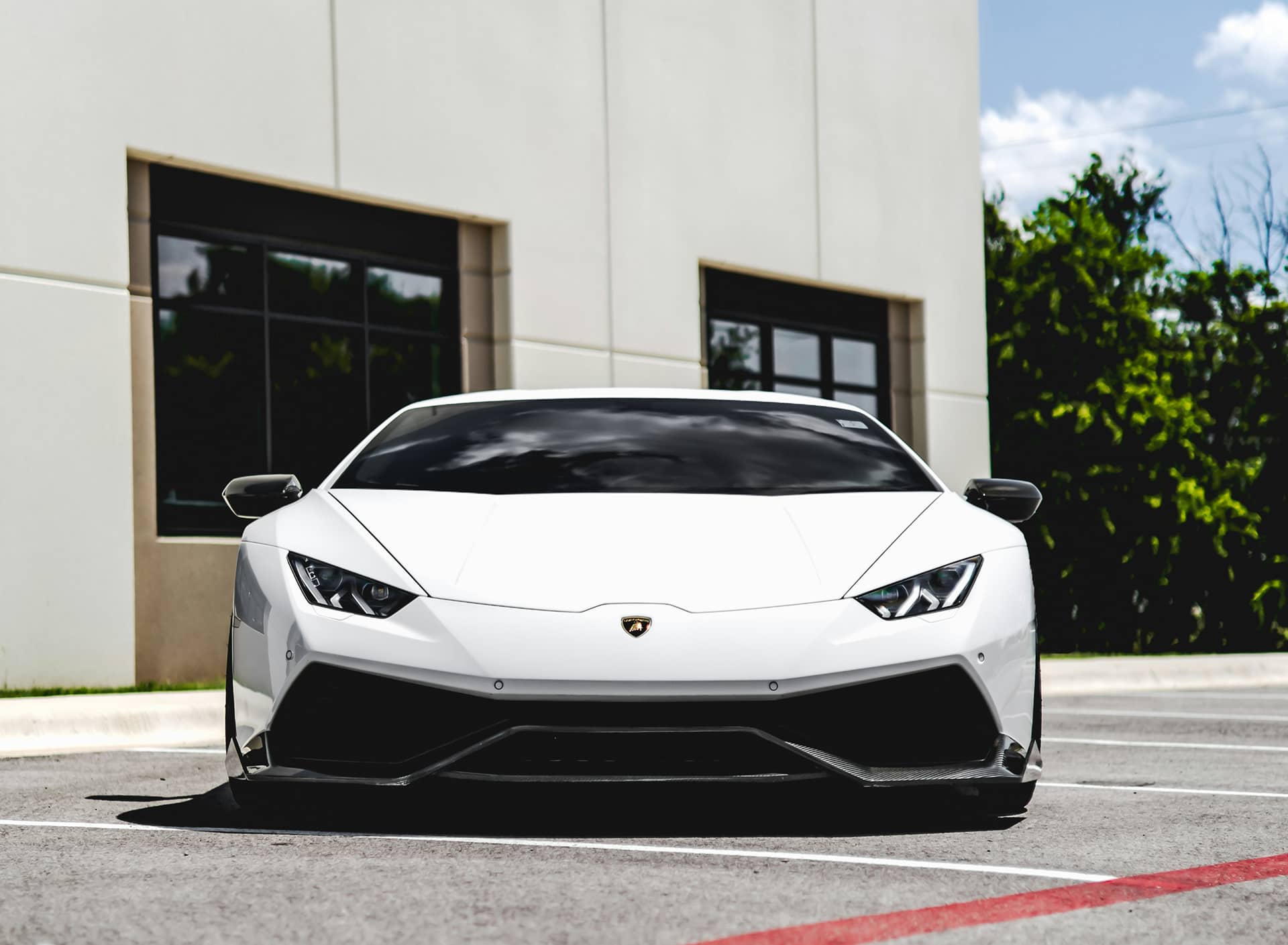 White Lamborghini Huracán parked in a lot