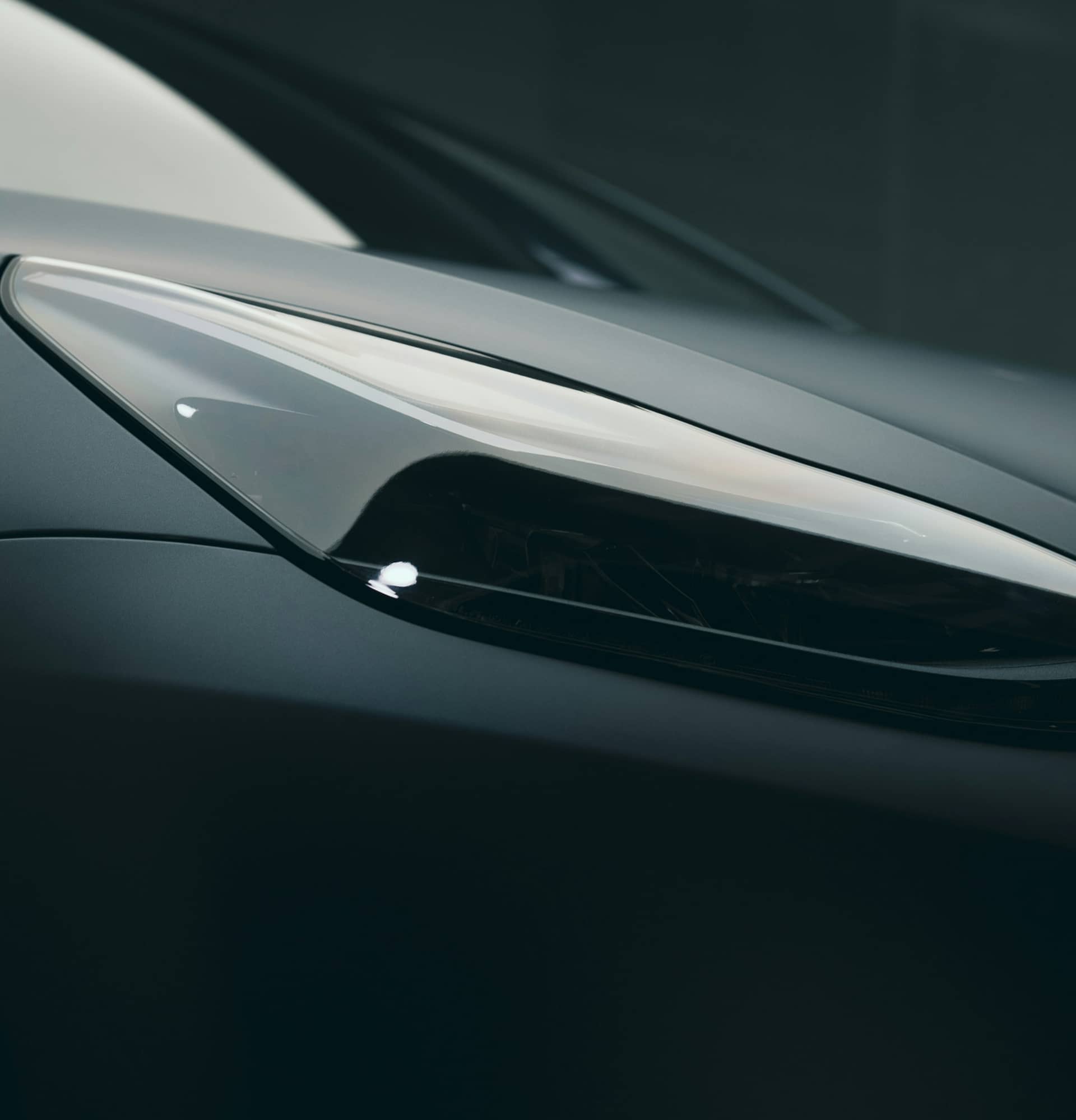 Close-up of a gray car headlight