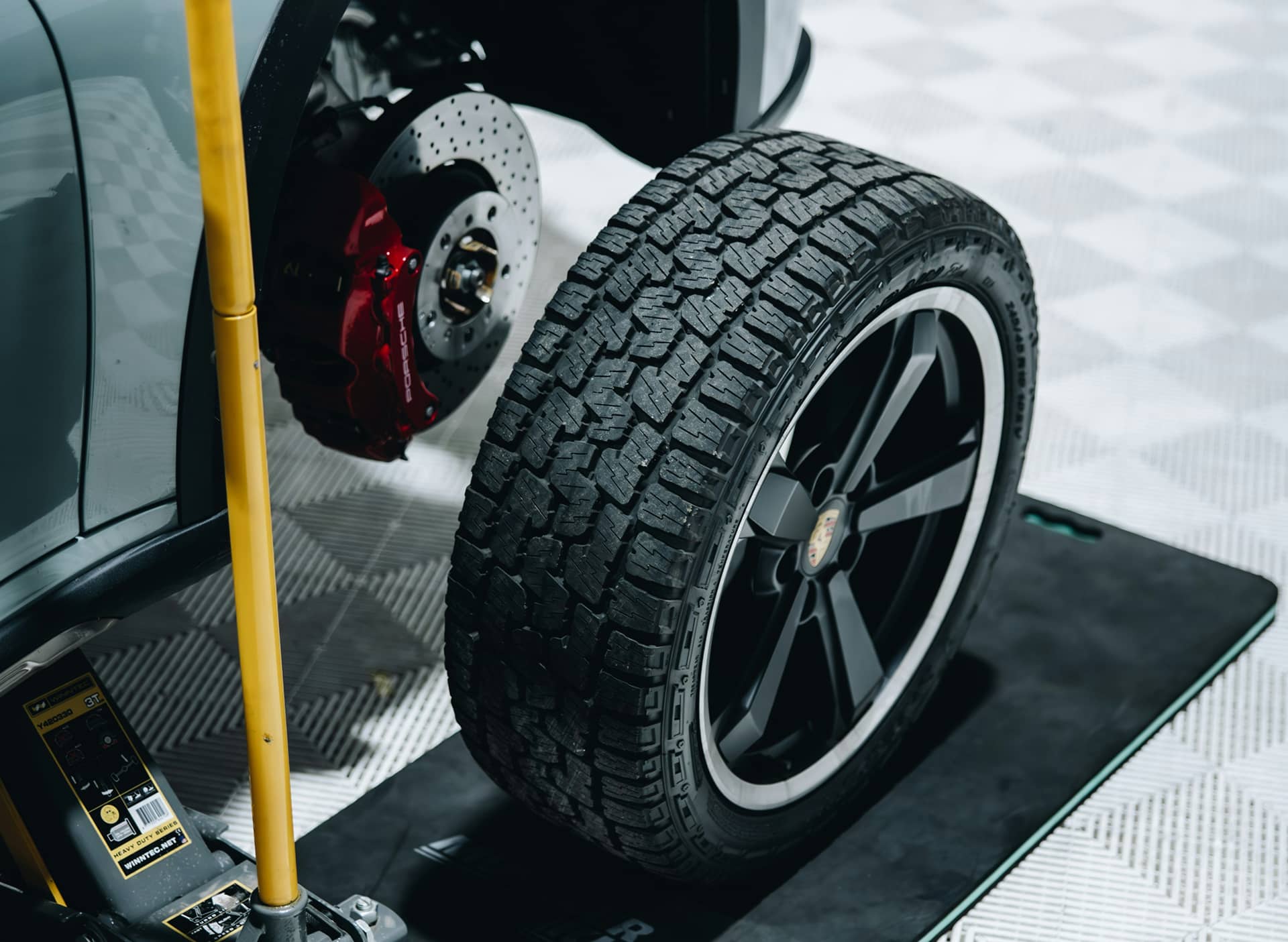 Tire and brake rotor removed from a car during a wheel service